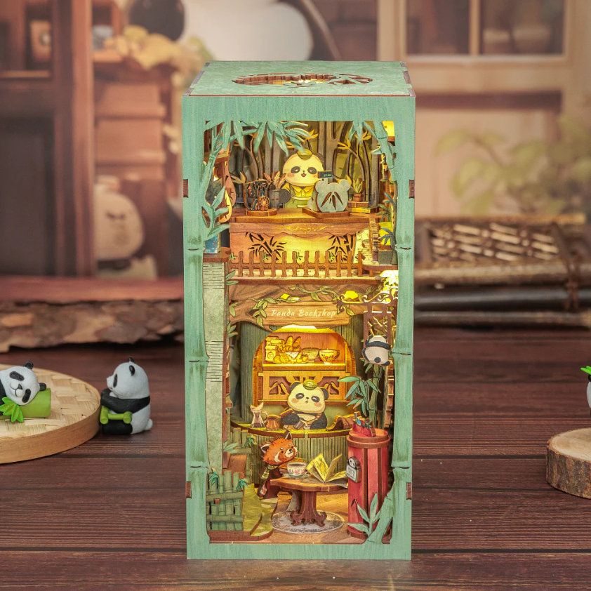 Diorama of a fantasy bookstore with a panda.